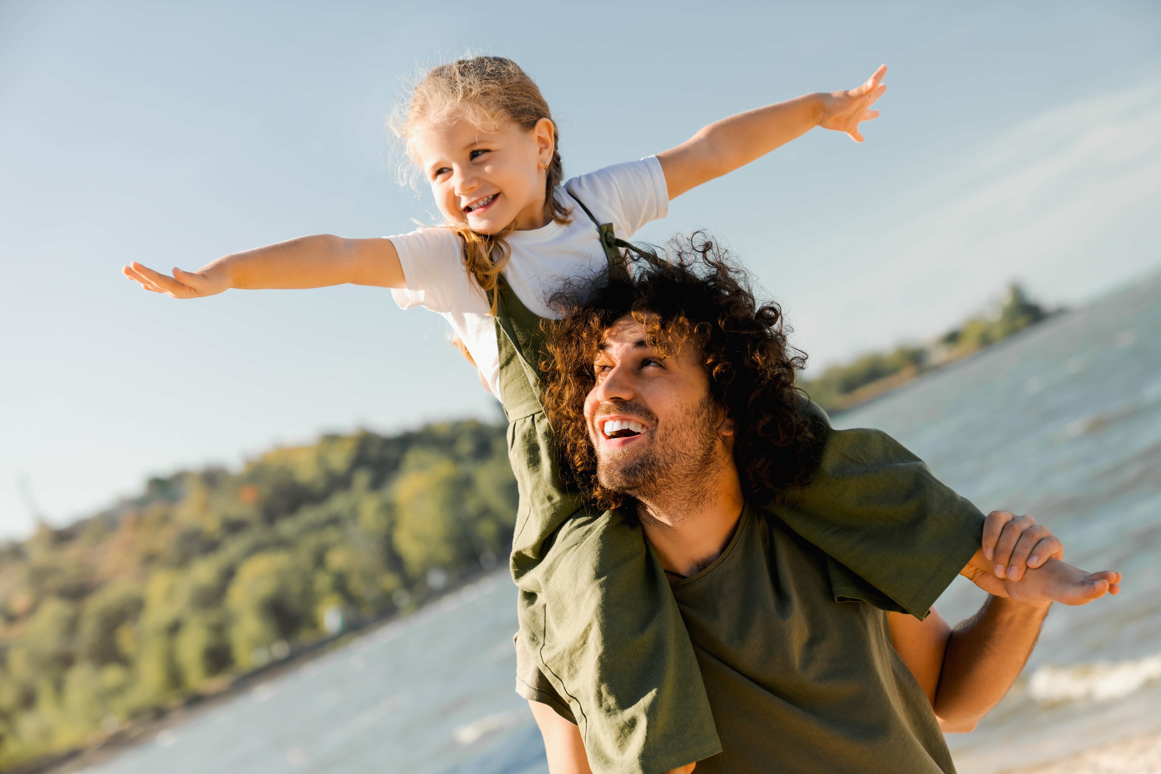 Father carrying his child outdoors